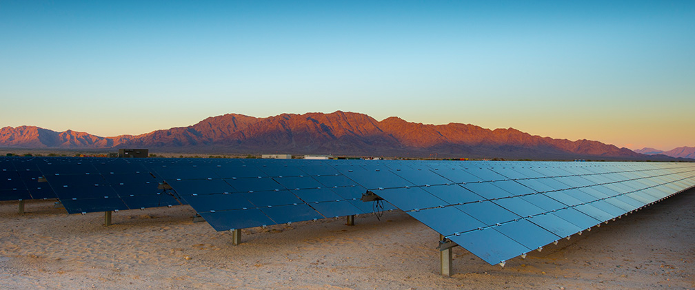 Rows of solar panels at utility-scale solar farm in Western U.S.